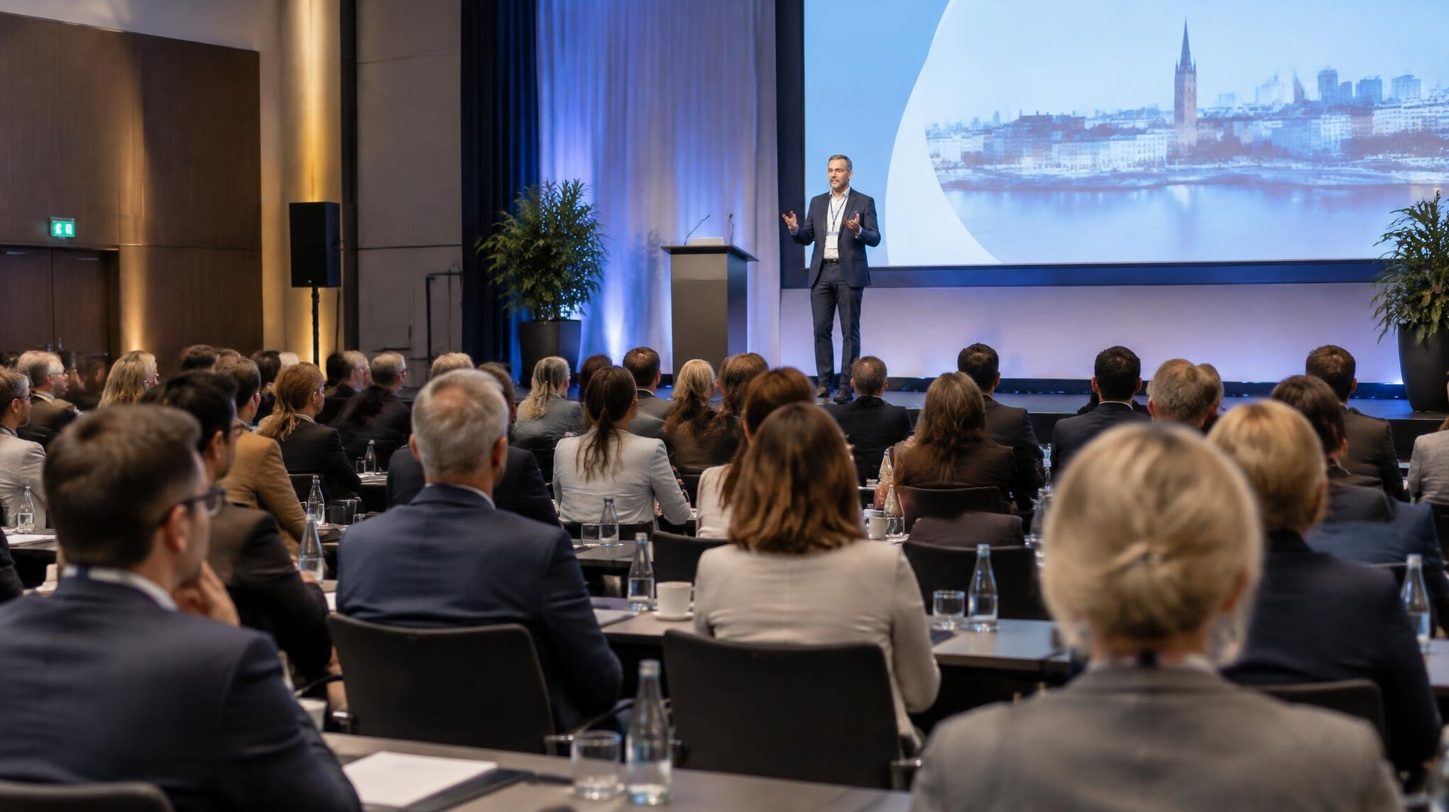 Business conference with attendees listening
