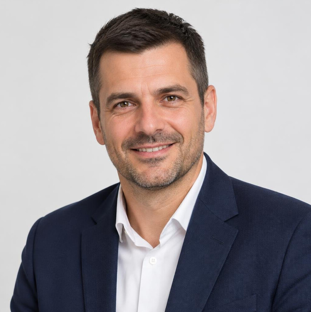 Portrait of a smiling man with short dark hair