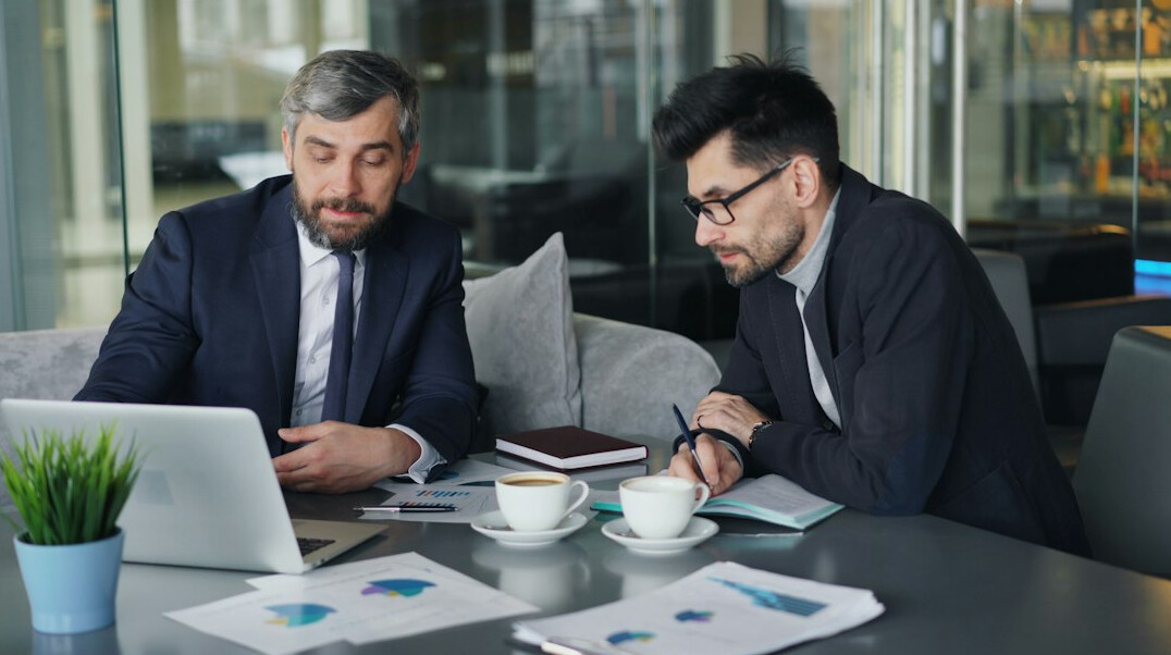 business leaders analyzing data
